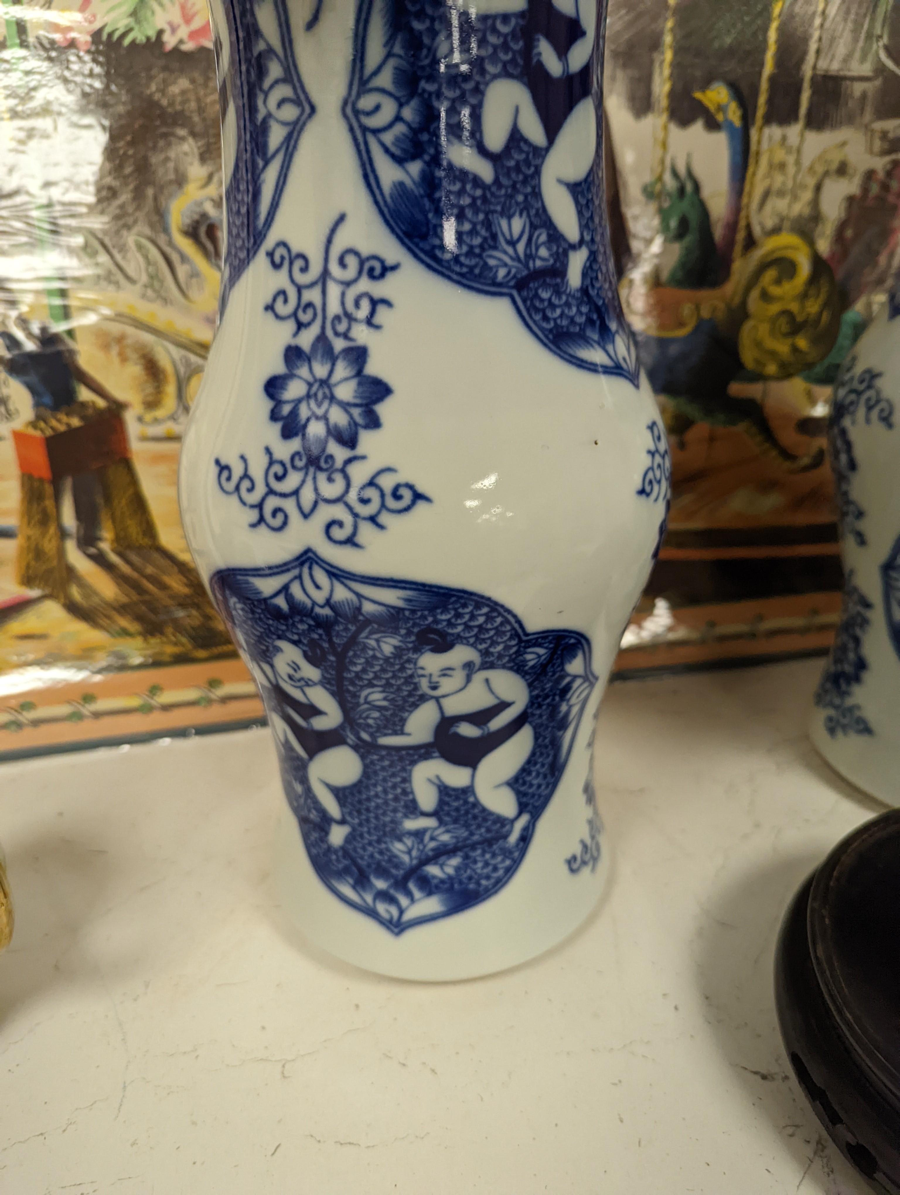A pair of Chinese blue and white vases on stands and 4 further wood stands. Vases 35cm